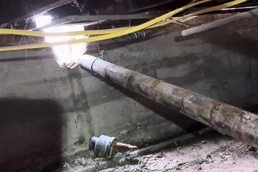Crawlspace plumbing with drain and supply lines below the floor related to Heritage 1920s detail reflecting Monrovia's Old Town architecture