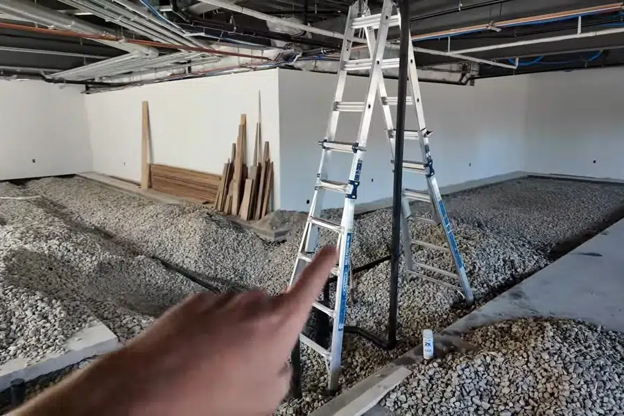 Commercial plumbing work area with open space, piping, and building materials related to Commercial water heater service in Monrovia