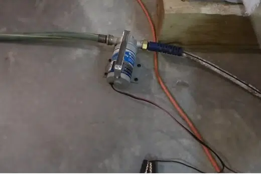 Sump pump basin and pump components being fitted near a foundation related to El Monte CA neighborhood