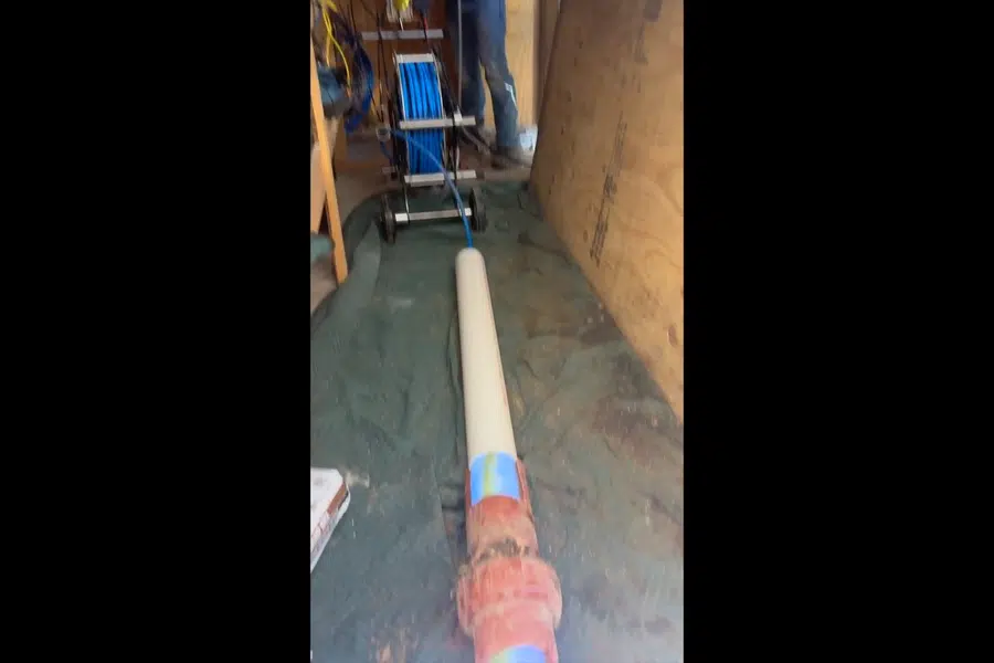 Trenchless sewer repair equipment and liner materials at the work area related to Repiping a Mayflower Village home