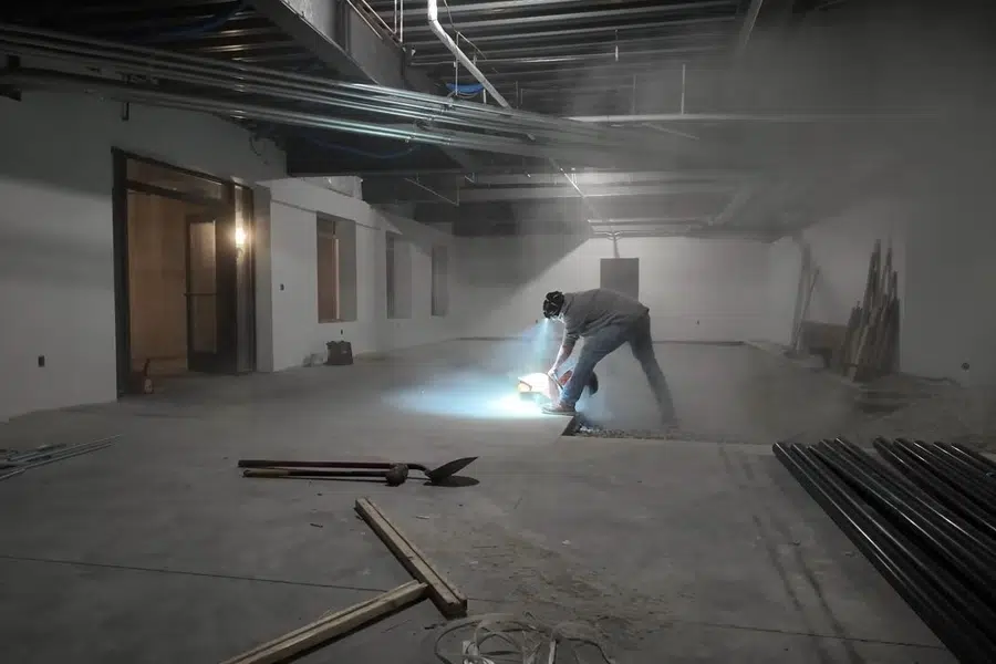 Commercial plumbing work area with open space, piping, and building materials related to Commercial grease line jetting in Monrovia