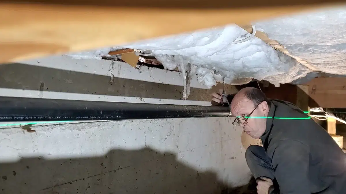 Crawlspace plumbing with drain and supply lines below the floor related to Tree-lined street over clay sewers in Monrovia