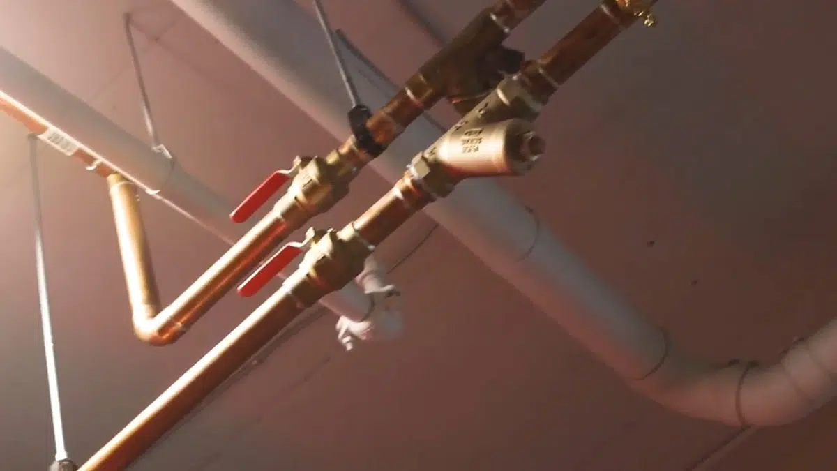 New PEX and copper pipe connections being installed during a repipe related to Whole-home repiping in Monrovia