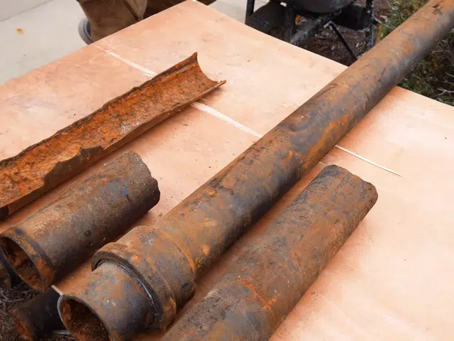Corroded cast iron pipe section with visible rust and buildup related to Cast iron drain during a Monrovia bath remodel