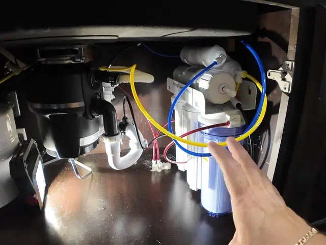 Garbage disposal mounted below a kitchen sink drain related to Garbage disposal reset button