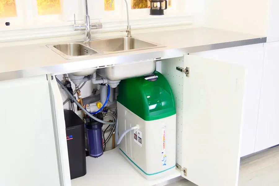 Under-sink reverse osmosis filter system connected below a cabinet related to Irwindale residential neighborhood