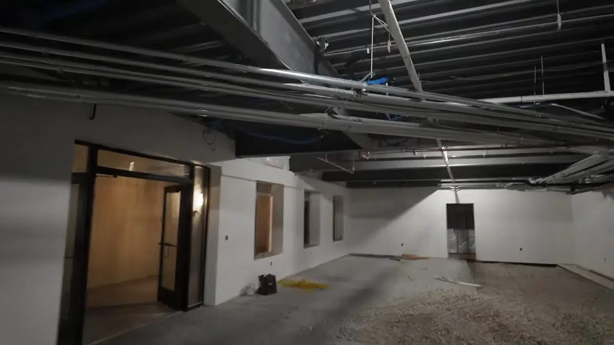 Commercial plumbing work area with open space, piping, and building materials related to Commercial plumbing in Monrovia