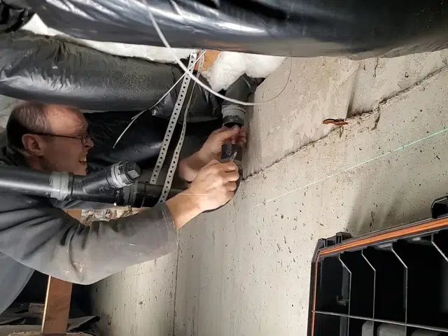 Crawlspace plumbing with drain and supply lines below the floor related to Camera-verified clean sewer line in Monrovia