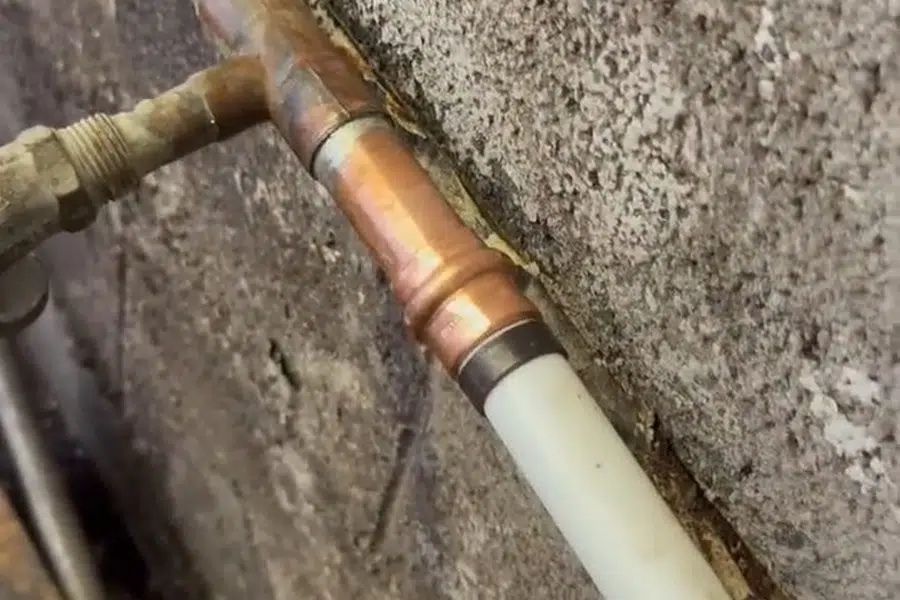 Exterior water service line repair with pipe exposed in soil related to Slab leak detection in the Monrovia Hills