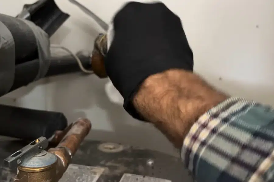 Leaking water heater supply connection above a tank related to Slab leak detection in South Monrovia