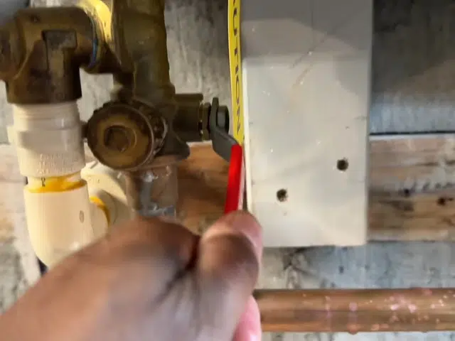 Tankless water heater flush hoses connected for descaling service related to Tankless water heater error code
