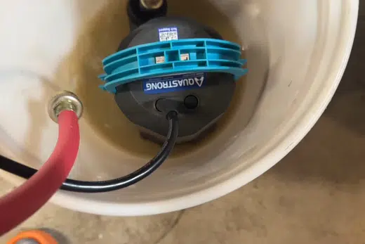 Tankless water heater flush hoses connected for descaling service related to Tankless Water Heater Services in Monrovia