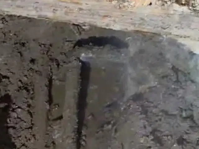 Concrete floor or slab opened to expose leaking plumbing below related to Thermal imaging of a slab leak warm spot