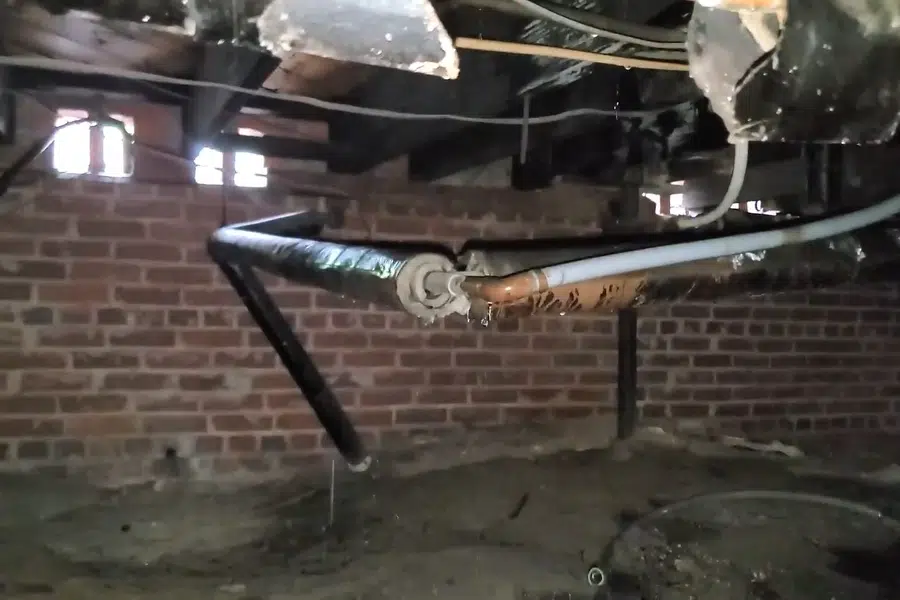 Crawlspace plumbing with drain and supply lines below the floor related to Thermal imaging of a hidden leak in Monrovia