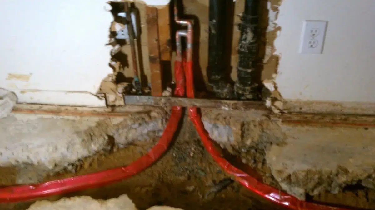 Tank water heater with new supply connections during installation in Monrovia