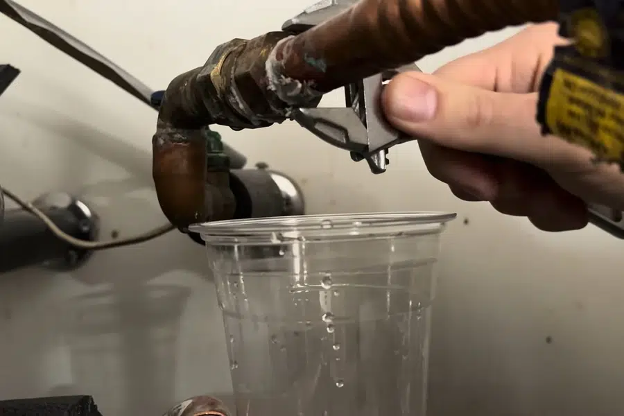 Leaking water heater supply connection above a tank related to Water heater service in El Monte