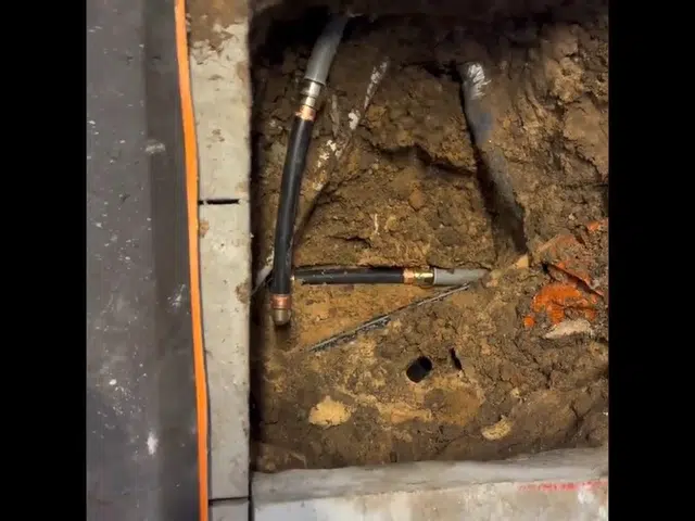 Concrete floor or slab opened to expose leaking plumbing below related to Water meter leak check in Monrovia